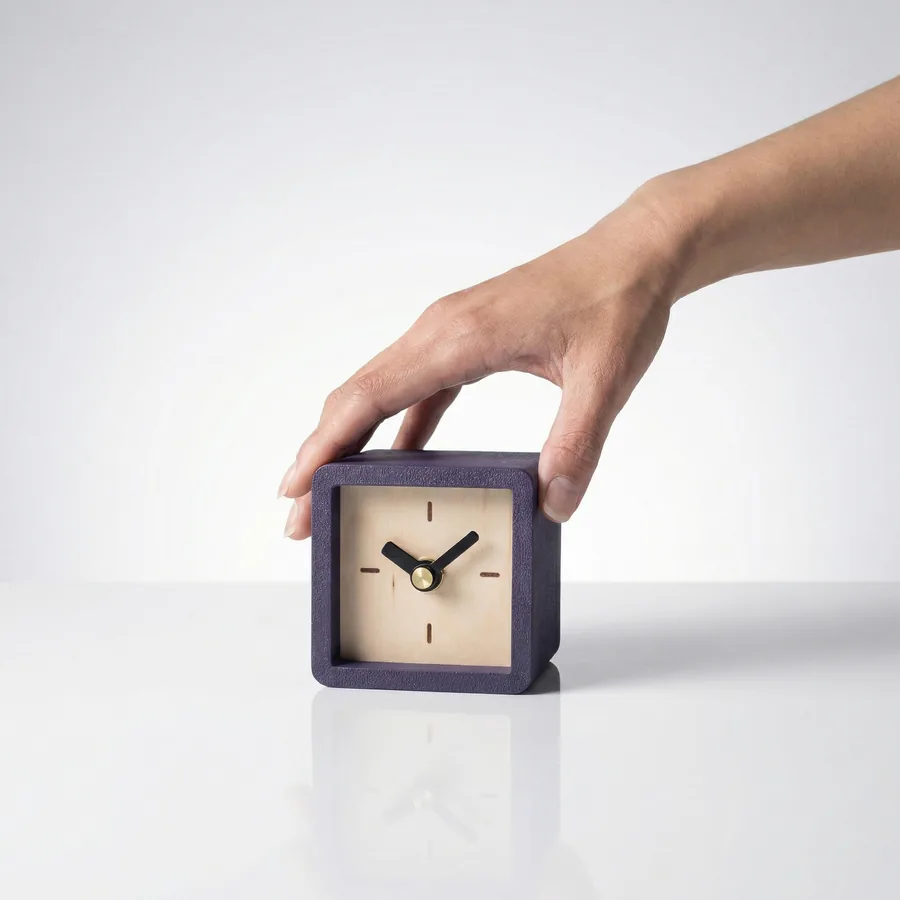Cube Clock held in a hand for scale